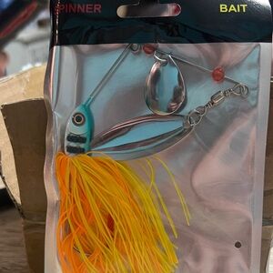 Vibrant Spinner Bait with Orange and Yellow Skirt